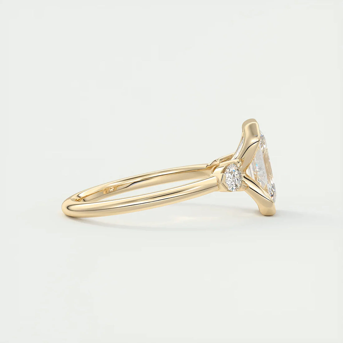 Emerald & Pear Clutch Three-Stone Engagement Ring