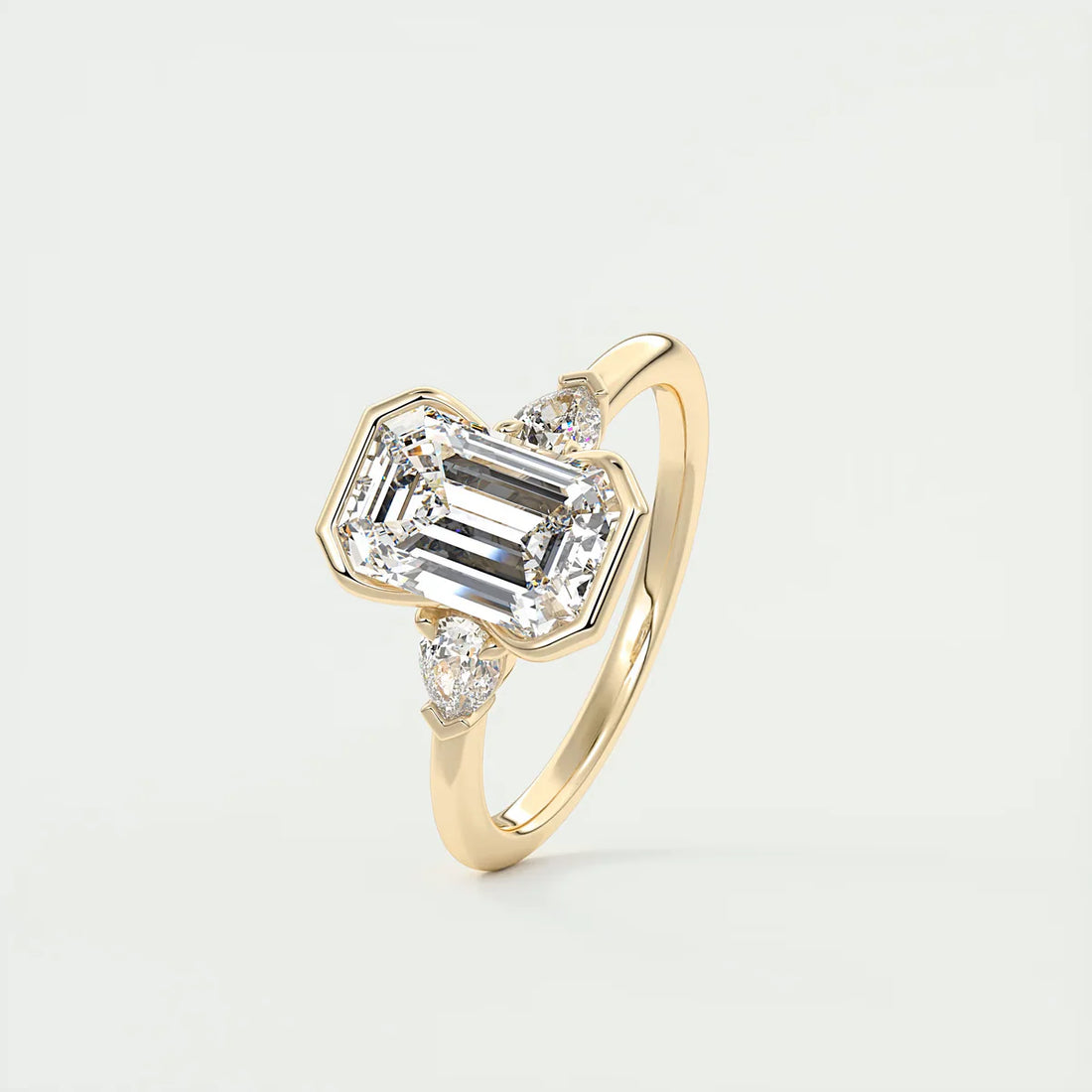 Emerald & Pear Clutch Three-Stone Engagement Ring