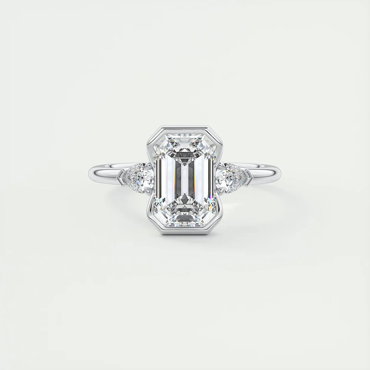 Emerald & Pear Clutch Three-Stone Engagement Ring