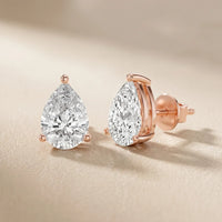 Iris Three-Prong Pear Diamond Earrings