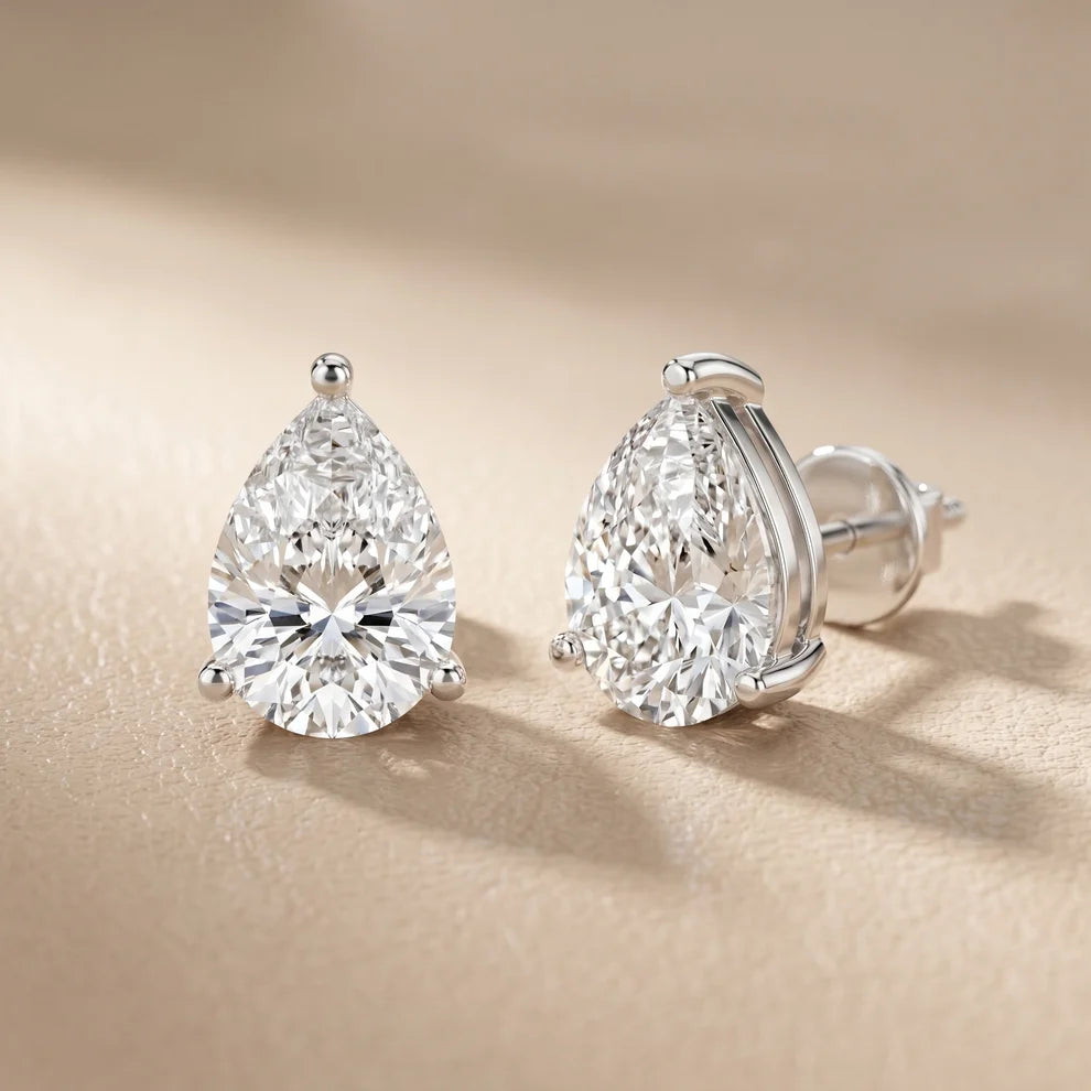 Iris Three-Prong Pear Diamond Earrings