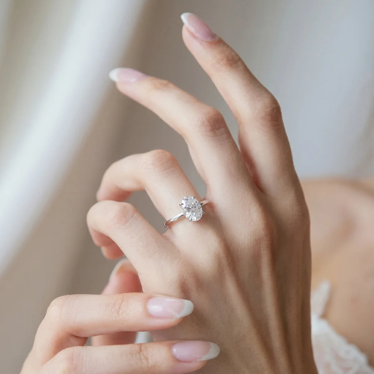 Oval Cut Solitaire Open Band Ring in Sterling Silver