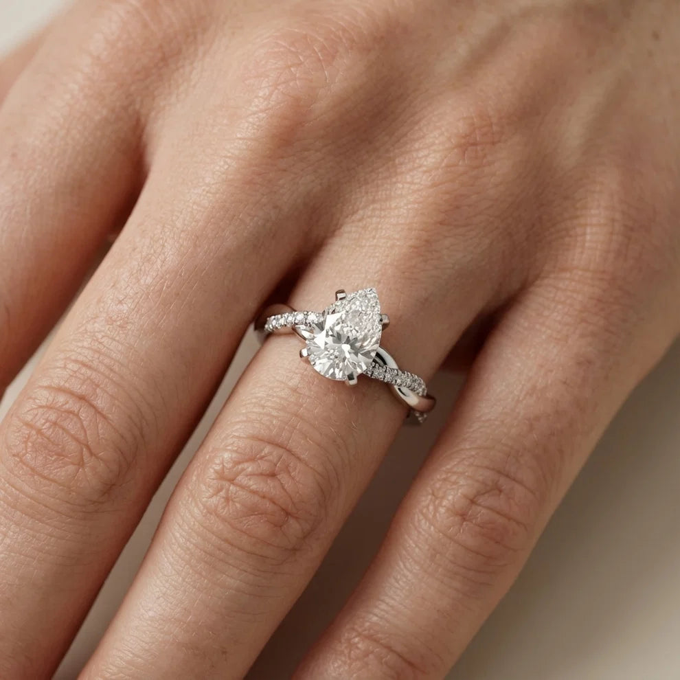 Twisted Side Stone Pear Diamond Engagement & Wedding Ring