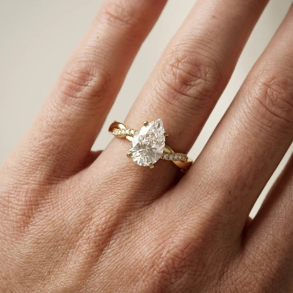 Twisted Side Stone Pear Diamond Engagement & Wedding Ring