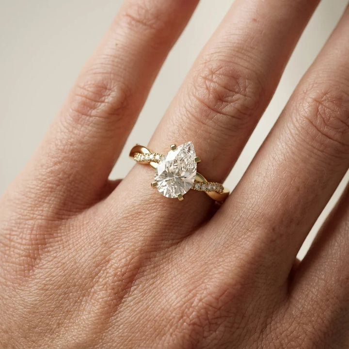 Twisted Side Stone Pear Diamond Engagement & Wedding Ring