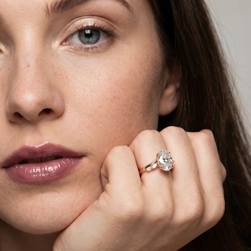 Flora Twist Side Stone Oval Diamond Engagement & Wedding Ring
