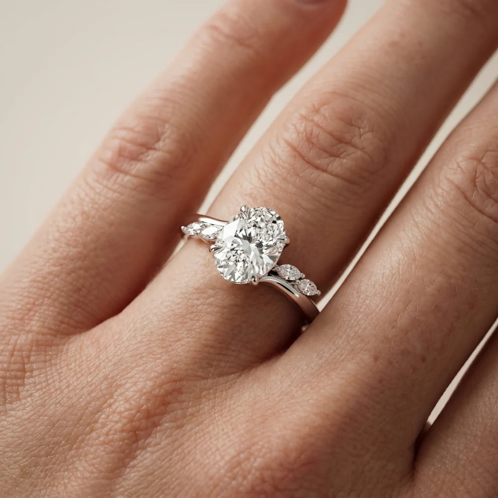 Flora Twist Side Stone Oval Diamond Engagement & Wedding Ring