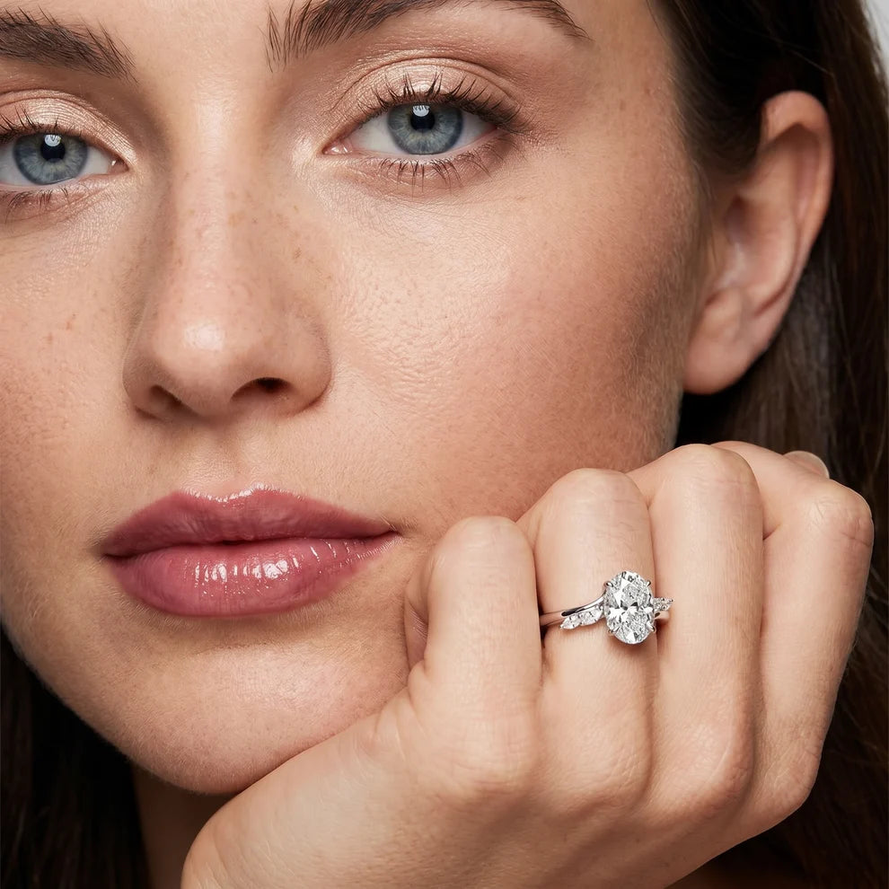 Flora Twist Side Stone Oval Diamond Engagement & Wedding Ring