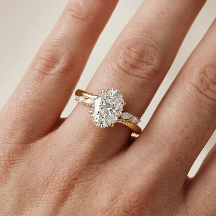 Flora Twist Side Stone Oval Diamond Engagement & Wedding Ring