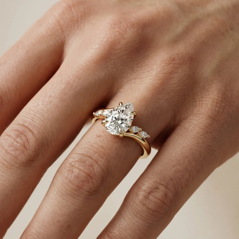 Flora Twist Side Stone Pear Diamond Engagement & Wedding Ring