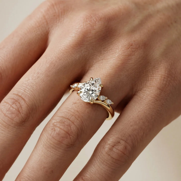 Flora Twist Side Stone Pear Diamond Engagement & Wedding Ring
